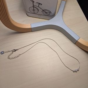 Faux pearl necklace.